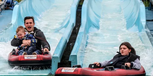 Kip Hakes and his family coming down the depth charge water slides
