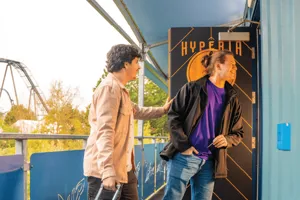 2 guests walking into the Hyperia Themed Cabin