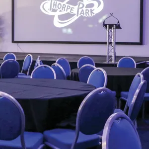 Conference Meetings, Stage Surrounded By Tables and Chairs