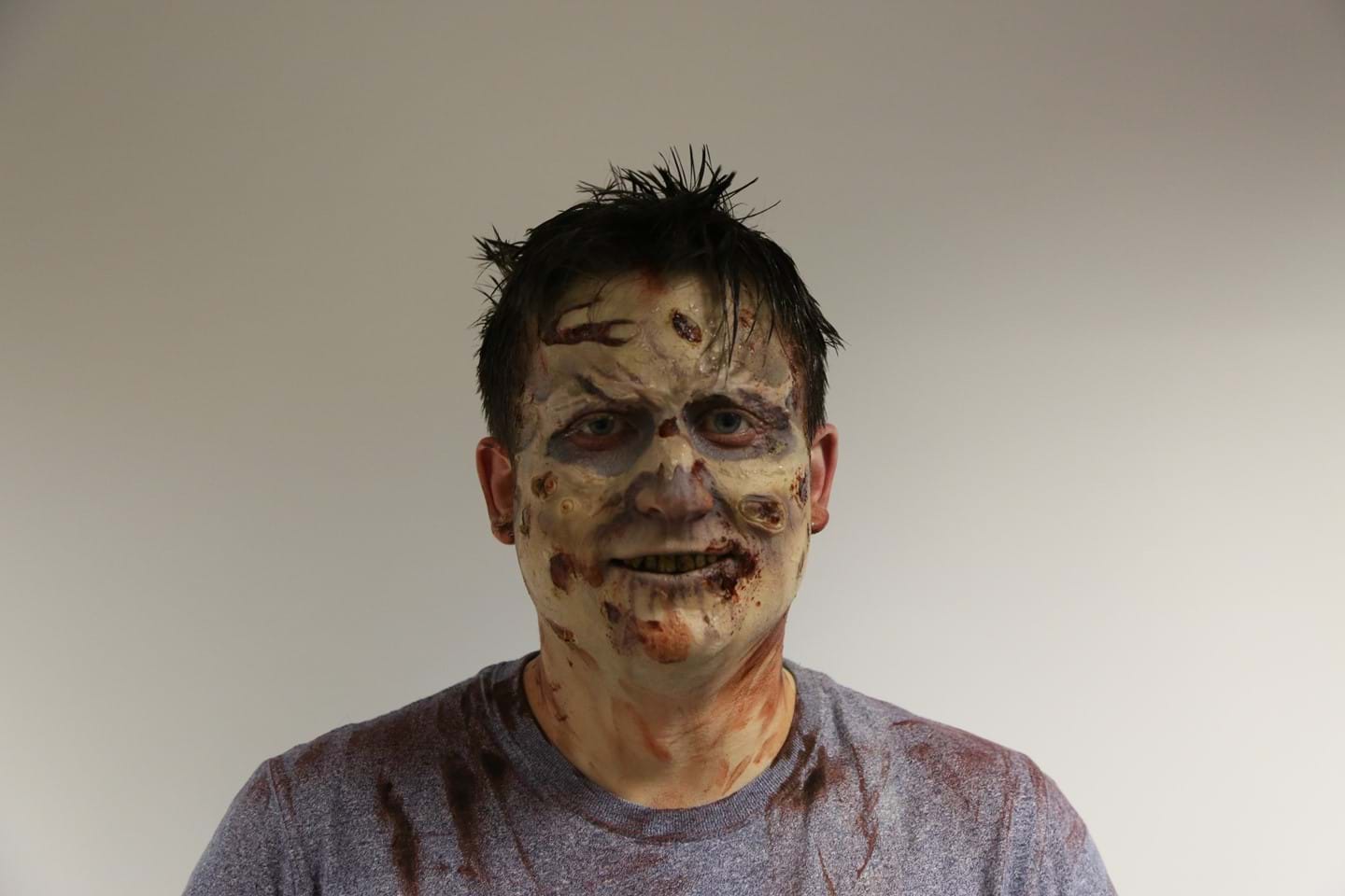 Kip Hakes having zombie makeup applied