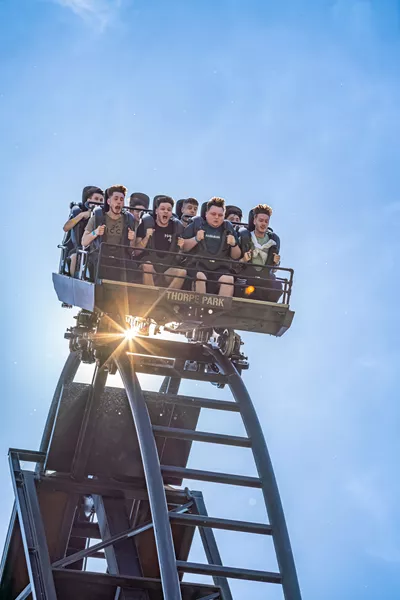 Guests holding on tight before they drop on SAW The Ride