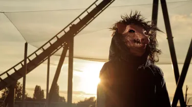 SAW pig head standing outside The Swarm