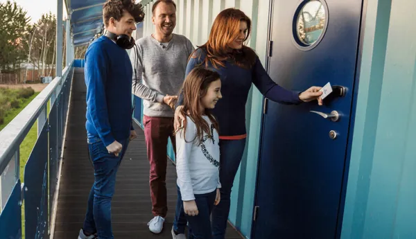 Thorpe Shark Cabins, family entering their room