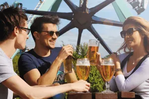 Theme Park Oktoberfest, Guests Drinking Around a Table