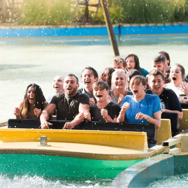 Tidal Wave Water Ride Soaking Wet Guests Closeup