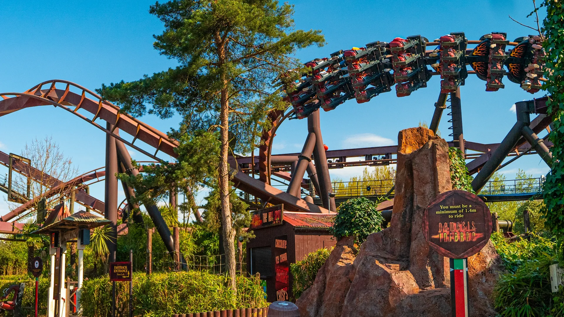 Nemesis inferno ride entrance on a sunny day at Thorpe Park