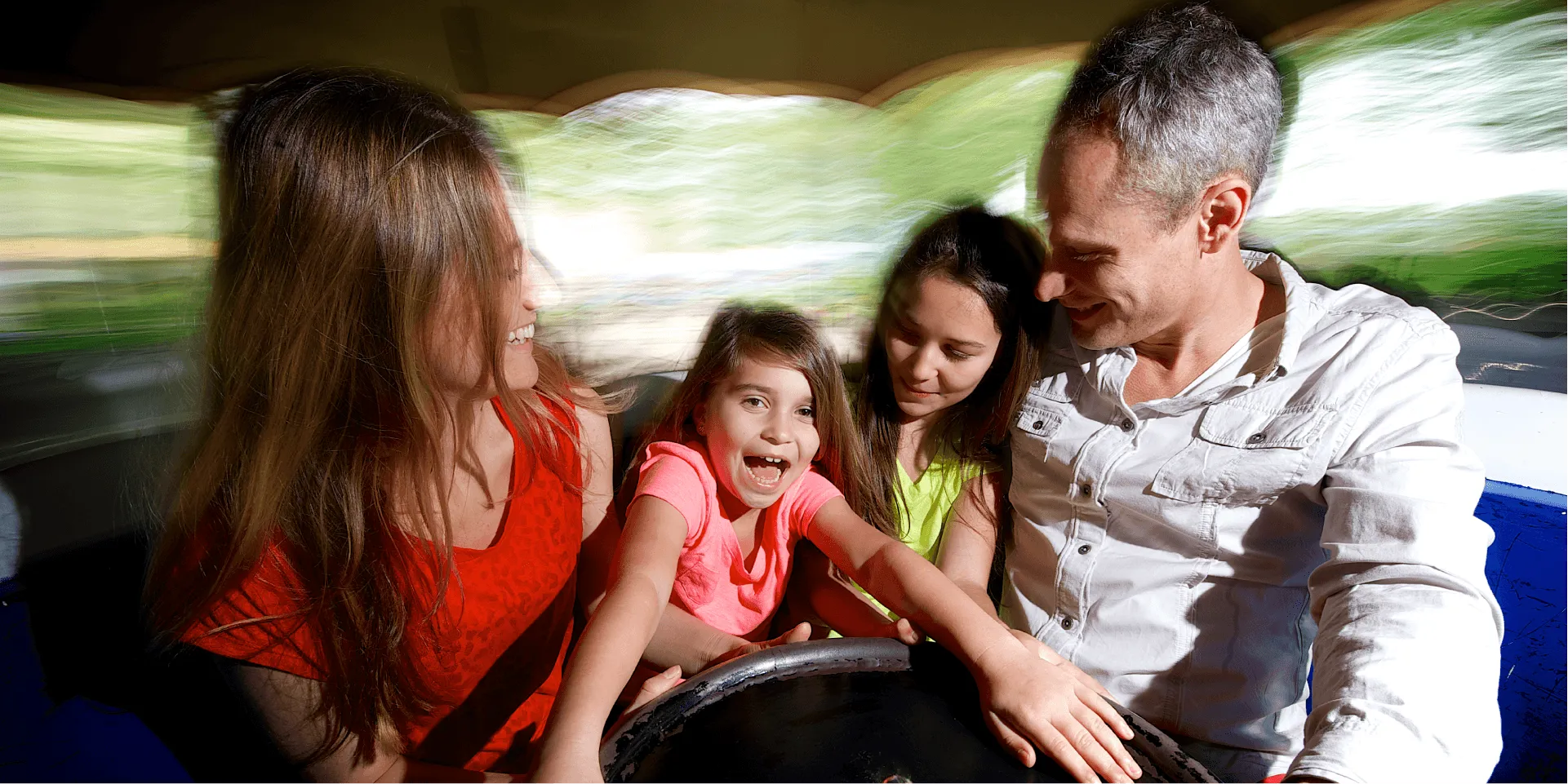 Family on Spinning Teacups Ride
