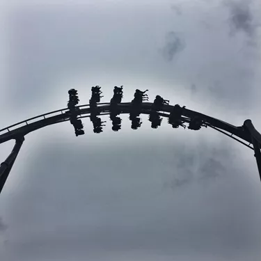 The Swarm Rollercoaster Surrounded By Clouds