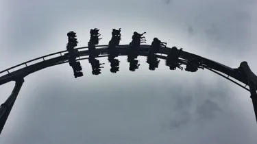 The Swarm Rollercoaster Surrounded By Clouds