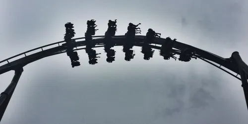 The Swarm Rollercoaster Surrounded By Clouds