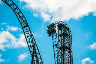 Guests going down the drop on SAW The Ride