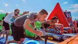 Bouncezilla, guests running towards the obstacle course