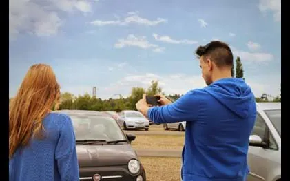 Guests taking a photo in the Car Park