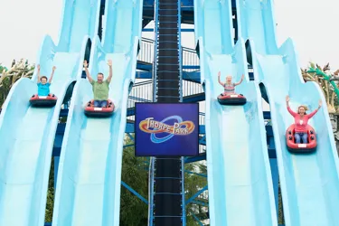 Guests coming down Depth Charge water slides