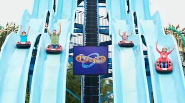 Guests coming down Depth Charge water slides